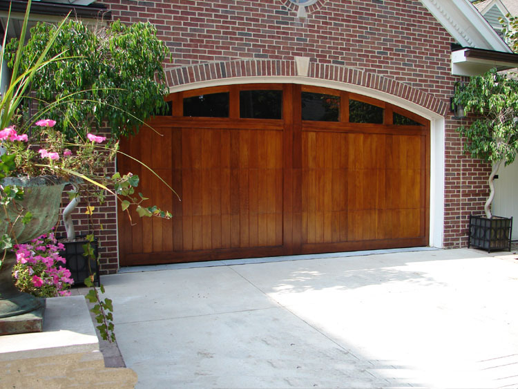 Wood garage door on a brick home